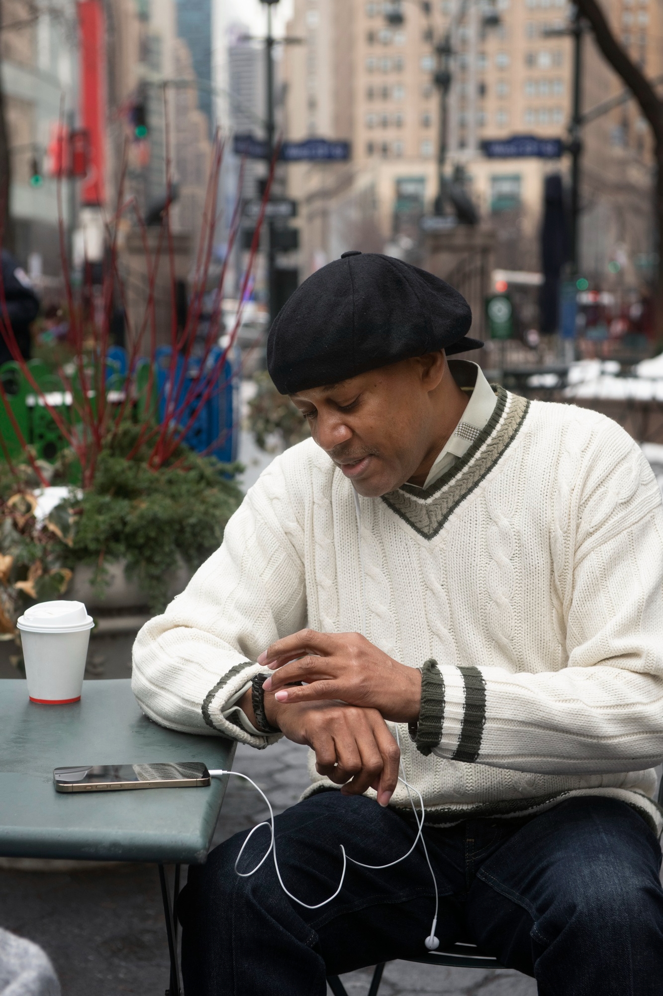 Customer checking PayFarGo on a smartwatch at an outdoor cafe