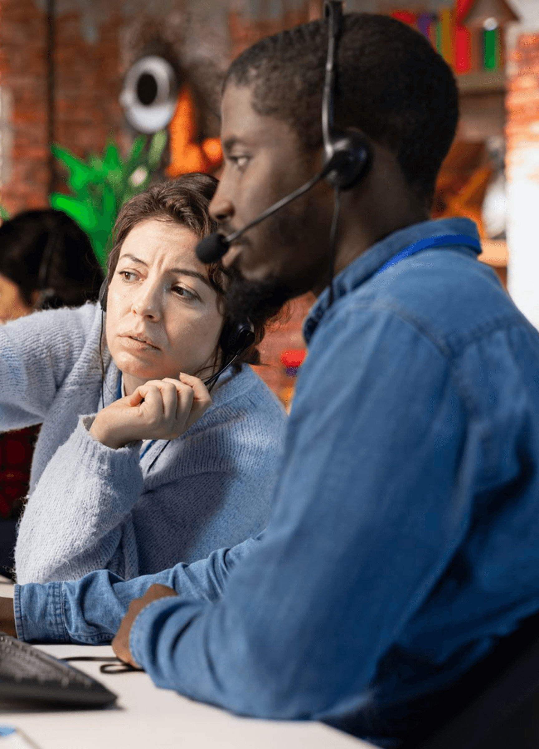 PayFarGo support team members with headsets assisting customers